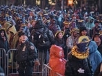 Revellers gather under the rain during the New Year's Eve celebrations in Times Square, New York, US. (AP) Revellers gather under the rain during the New Year's Eve celebrations in Times Square, New York, US. (AP)