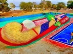 Odisha: Sand artist Sudarsan Pattnaik creates a '105 feet Hockey stick with 5000 Hockey ball' sand sculpture near Barabati Stadium in Mahanadi, Cuttack(PTI) Odisha: Sand artist Sudarsan Pattnaik creates a '105 feet Hockey stick with 5000 Hockey ball' sand sculpture near Barabati Stadium in Mahanadi, Cuttack(PTI)