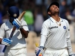 Murali Vijay (Left) reacts after Virender Sehwag completes his century Murali Vijay (Left) reacts after Virender Sehwag completes his century