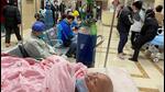 A patient lies on a bed at the emergency department of a hospital, amid the Covid-19 outbreak in Shanghai, China, on Tuesday (REUTERS) A patient lies on a bed at the emergency department of a hospital, amid the Covid-19 outbreak in Shanghai, China, on Tuesday (REUTERS)
