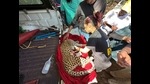Members of ResQ Charitable trust treating the leopard. (HT PHOTO) Members of ResQ Charitable trust treating the leopard. (HT PHOTO)