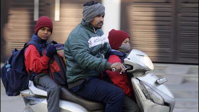 Children going to school on a cold winter morning on Khandsa road near DAV high school in Gurugram on Tuesday. (Parveen Kumar/HT Photo) Children going to school on a cold winter morning on Khandsa road near DAV high school in Gurugram on Tuesday. (Parveen Kumar/HT Photo)