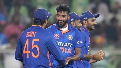 India's Mohammed Siraj, second left, celebrates with captain Rohit Sharma (AP) India's Mohammed Siraj, second left, celebrates with captain Rohit Sharma (AP)
