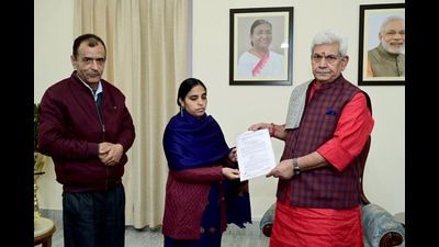 J&K lieutenant governor Manoj Sinha handing over the appointment letter of a government job to Sweety Bhat, wife of Puran Krishan Bhat who was shot dead by terrorists in Shopian in October last year, in Jammu on Tuesday. (ANI) J&K lieutenant governor Manoj Sinha handing over the appointment letter of a government job to Sweety Bhat, wife of Puran Krishan Bhat who was shot dead by terrorists in Shopian in October last year, in Jammu on Tuesday. (ANI)