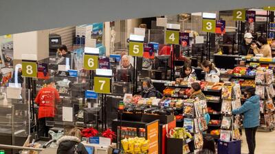 People pay for their items at a grocery store in Toronto, Ontario, Canada. (REUTERS/FILE)