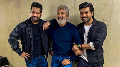 Actors Jr NTR and Ram Charan with their RRR director SS Rajamouli. (PTI Photo) (PTI) Actors Jr NTR and Ram Charan with their RRR director SS Rajamouli. (PTI Photo) (PTI)