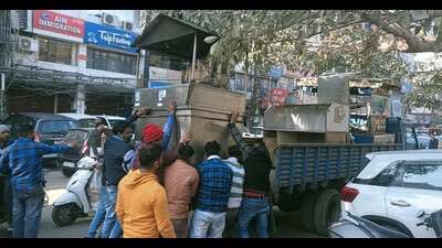 The Municipal Corporation (MC) carried out a massive anti- encroachment drive in Feroze Gandhi Market in Ludhiana on Tuesday. (HT Photo)