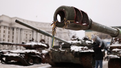 Russia-Ukraine War: Ribbons with the colours of the Ukrainian flag are tied to the cannon of a destroyed Russian tank. (Reuters)