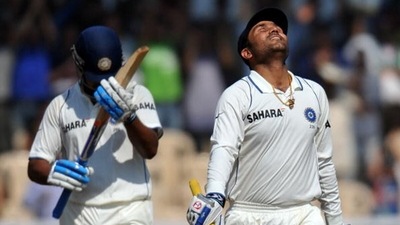 Murali Vijay (Left) reacts after Virender Sehwag completes his century (Getty)