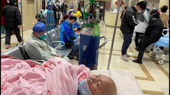 A patient lies on a bed at the emergency department of a hospital, amid the Covid-19 outbreak in Shanghai, China, on Tuesday (REUTERS)