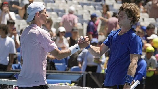 Andrey Rublev, right, of Russia is congratulated by Dominic Thiem of Austria following their first round match at the Australian Open(AP)