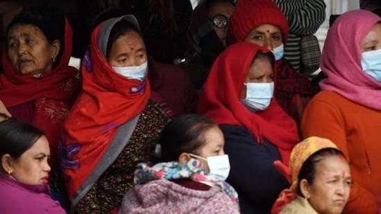 Family members of victims who died in the Yeti Airlines plane crash wait outside a hospital, in Pokhara on Tuesday. (AFP)