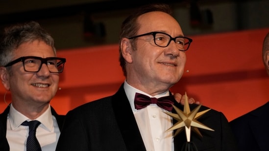 Actor Kevin Spacey, with National Museum of Cinema's director Domenico De Gaetano, receives an award at the National Museum of Cinema in Turin, Italy on January 16, 2023. (AP Photo/Luca Bruno)(AP)