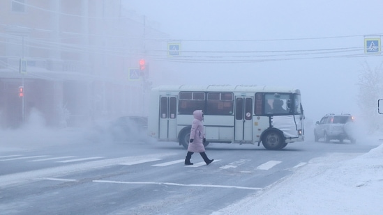 Yakutsk In Russia: A pedestrian crosses a road on a frosty day in Yakutsk, Russia. (Reuters)
