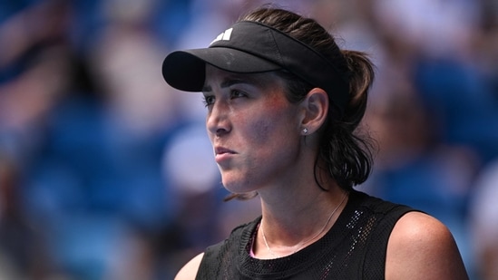 Spain's Garbine Muguruza reacts after a point against Belgium's Elise Mertens during their women's singles match on day two of the Australian Open tennis tournament in Melbourne on January 17, 2023. (Photo by WILLIAM WEST / AFP) / -- IMAGE RESTRICTED TO EDITORIAL USE - STRICTLY NO COMMERCIAL USE --(AFP)