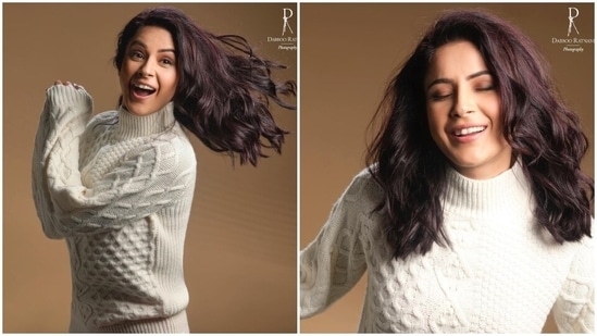 Shehnaaz slipped into a white knit sweater for the photoshoot. It features a turtle neckline, full-length sleeves, a knit design, ribbed details on the neck, cuffs and hem, drop shoulders, and a figure-skimming silhouette. (Instagram)
