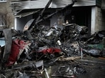 At the scene, debris was scattered over a muddy playground and emergency workers milled about a fleet of ambulances.(AP)