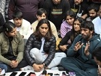 Vinesh Phogat, Sakshi Malik, Bajrang Punia, and others react during a press conference regarding wrestlers' protest against the Wrestling Federation of India, at Jantar Mantar in New Delhi on Wednesday(HT Photo) Vinesh Phogat, Sakshi Malik, Bajrang Punia, and others react during a press conference regarding wrestlers' protest against the Wrestling Federation of India, at Jantar Mantar in New Delhi on Wednesday(HT Photo)