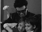 Karan Johar with twins Yash and Roohi from their indoor photoshoot. Karan Johar with twins Yash and Roohi from their indoor photoshoot.