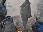 People warm themselves around a bonfire on a cold winter morning at Ghazipur market in New Delhi on December 16. According to the India Meteorological Department (IMD) bulletin, cold wave conditions are very likely in pockets over Punjab, Haryana, Chandigarh, Delhi, west Uttar Pradesh and north Rajasthan during the next three days. (Raj K Raj / HT Photo) People warm themselves around a bonfire on a cold winter morning at Ghazipur market in New Delhi on December 16. According to the India Meteorological Department (IMD) bulletin, cold wave conditions are very likely in pockets over Punjab, Haryana, Chandigarh, Delhi, west Uttar Pradesh and north Rajasthan during the next three days. (Raj K Raj / HT Photo)