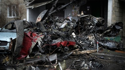 At the scene, debris was scattered over a muddy playground and emergency workers milled about a fleet of ambulances. (AP)