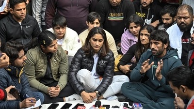 Vinesh Phogat, Sakshi Malik, Bajrang Punia, and others react during a press conference regarding wrestlers' protest against the Wrestling Federation of India, at Jantar Mantar in New Delhi on Wednesday (HT Photo) Vinesh Phogat, Sakshi Malik, Bajrang Punia, and others react during a press conference regarding wrestlers' protest against the Wrestling Federation of India, at Jantar Mantar in New Delhi on Wednesday (HT Photo)