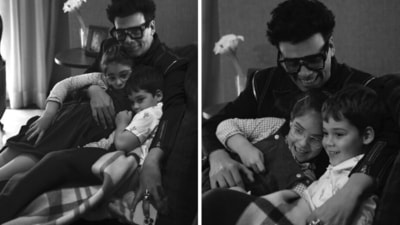 Karan Johar with twins Yash and Roohi from their indoor photoshoot. Karan Johar with twins Yash and Roohi from their indoor photoshoot.