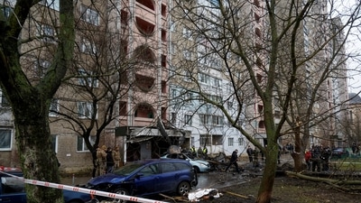 Dead bodies lay on the ground at the scene where a helicopter crashed on civil infrastructure in Brovary. (REUTERS)