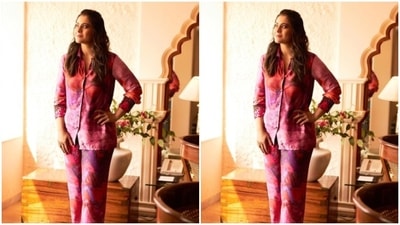 Kajol teamed a pink and red satin shirt with sequin details at the collars and the cuffs, with a pair of matching satin trousers, as she added fun vibes to her formal look. (Instagram/@kajol) Kajol teamed a pink and red satin shirt with sequin details at the collars and the cuffs, with a pair of matching satin trousers, as she added fun vibes to her formal look. (Instagram/@kajol)