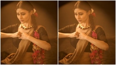Mouni looked ethereal in a pastel ochre cotton saree which she pleated and styled it over a black blouse with long sleeves. (Instagram/@imouniroy) Mouni looked ethereal in a pastel ochre cotton saree which she pleated and styled it over a black blouse with long sleeves. (Instagram/@imouniroy)