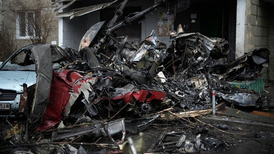 At the scene, debris was scattered over a muddy playground and emergency workers milled about a fleet of ambulances.(AP)