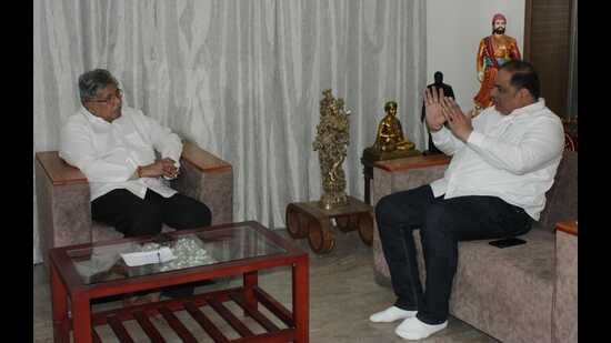 Guardian Minister Chandrakant Patil (left) held a discussion with Pune Merchant Bank Chairman Vijay Dhere on Wednesday (HT PHOTO)