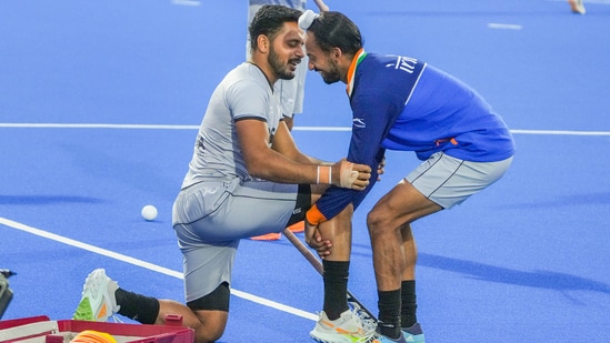 Indian hockey team captain Harmanpreet Singh and Hardik Singh share a light moment during their training session (PTI)