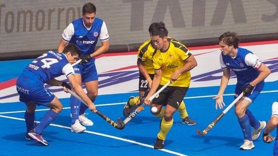 Players of Malaysia (yellow) and Chile vie for the ball during their Hockey Men's World Cup 2023 match at Birsa Munda Stadium in Rourkela(PTI)