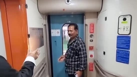 The man was seen in the video chatting with the ticket collector, requesting him to open the door that was locked by the automatic system when the train began moving. (Screengrab/Twitter video by Dr Kiran Kumar Karlapu)