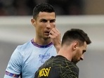 Cristiano Ronaldo gestures playing for a combined XI of Saudi Arabian teams Al Nassr and Al Hilal is flanked by PSG's Lionel Messi during a friendly match(AP) Cristiano Ronaldo gestures playing for a combined XI of Saudi Arabian teams Al Nassr and Al Hilal is flanked by PSG's Lionel Messi during a friendly match(AP)