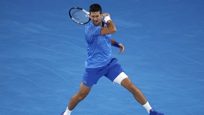 Novak Djokovic of Serbia plays a forehand return to Enzo Couacaud of France during their second round match at the Australian Open tennis championship in Melbourne, Australia, Thursday, Jan. 19, 2023. (AP) Novak Djokovic of Serbia plays a forehand return to Enzo Couacaud of France during their second round match at the Australian Open tennis championship in Melbourne, Australia, Thursday, Jan. 19, 2023. (AP)