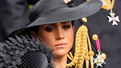 Meghan Markle: Meghan, Duchess of Sussex watches as the coffin of Queen Elizabeth II is placed into the hearse. (AP) Meghan Markle: Meghan, Duchess of Sussex watches as the coffin of Queen Elizabeth II is placed into the hearse. (AP)