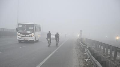 Gurugram, India-January 08, 2023: A group of cyclists rides bicycles at National Highway-48 amid cold and dense foggy morning near Signature Tower flyover, in Gurugram, India, on Sunday, 08 January 2023. (Photo by Parveen Kumar/Hindustan Times) Gurugram, India-January 08, 2023: A group of cyclists rides bicycles at National Highway-48 amid cold and dense foggy morning near Signature Tower flyover, in Gurugram, India, on Sunday, 08 January 2023. (Photo by Parveen Kumar/Hindustan Times)