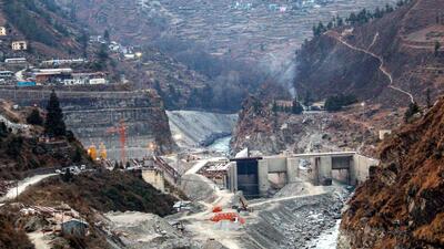 NTPC is building Tapovan hydel project, a tunnel of which is being dug below the Joshimath hills, and residents say that blasting in the tunnel caused an underground aquifer or stream to burst, exacerbating subsidence in the holy town. (PTI) NTPC is building Tapovan hydel project, a tunnel of which is being dug below the Joshimath hills, and residents say that blasting in the tunnel caused an underground aquifer or stream to burst, exacerbating subsidence in the holy town. (PTI)