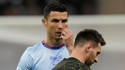 Cristiano Ronaldo gestures playing for a combined XI of Saudi Arabian teams Al Nassr and Al Hilal is flanked by PSG's Lionel Messi during a friendly match (AP) Cristiano Ronaldo gestures playing for a combined XI of Saudi Arabian teams Al Nassr and Al Hilal is flanked by PSG's Lionel Messi during a friendly match (AP)