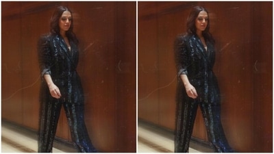 Neha looked like the ultimate boss lady in black blazer featuring sequin stripes. She teamed it with matching formal trousers. (Instagram/@nehadhupia) Neha looked like the ultimate boss lady in black blazer featuring sequin stripes. She teamed it with matching formal trousers. (Instagram/@nehadhupia)