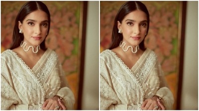 Sonam wore her tresses open in straight locks with a middle part and decked up in pink eyeshadow, black winged eyeliner, mascara-laden eyelashes, contoured cheeks and a shade of pastel pink lipstick.&nbsp; (Instagram/@sonamkapoor)