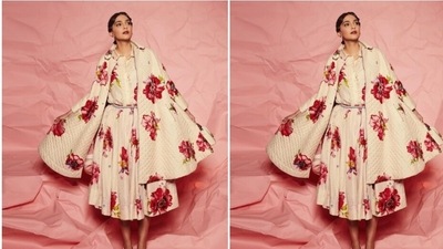 Sonam decked up in a white long frock featuring floral patterns in shades of red and yellow, and added a dramatic cape of the same print around her shoulders.&nbsp; (Instagram/@sonamkapoor)