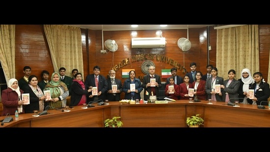 AMU V-C Prof Tariq Mansoor with Prof Asfar Ali Khan and Principals of schools during the distribution Urdu Translation of the Prime Minister’s book (HT Photo)