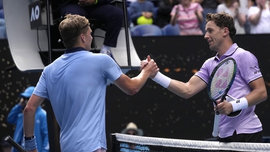 Jenson Brooksby, left, of the U.S. is congratulated by Casper Ruud of Norway following their second round match at the Australian Open tennis championship in Melbourne, Australia, Thursday, Jan. 19, 2023. (AP Photo/Dita Alangkara)(AP)
