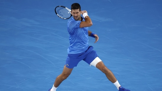 Novak Djokovic of Serbia plays a forehand return to Enzo Couacaud of France during their second round match at the Australian Open tennis championship in Melbourne, Australia, Thursday, Jan. 19, 2023. (AP)