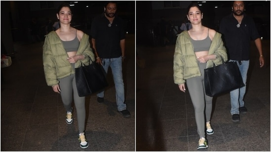 Coming to the outfit details, the grey sports bra features spaghetti straps, a scoop neckline, a fitted bust and a cropped hem length to flaunt her toned midriff. Tamannaah styled the top with matching tights featuring a high-rise waist and a bodycon fit.&nbsp;(HT Photo/Varinder Chawla)
