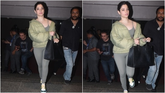Regarding the airport look, Tamannaah chose a comfy and stylish athleisure outfit featuring a light grey sports bra, matching tights and a light green puffer jacket. The star showed her fans how to glam up everyday looks with her stylish ensemble. The whole set is the perfect addition to your activewear closet.&nbsp;(HT Photo/Varinder Chawla)
