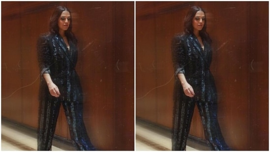 Neha looked like the ultimate boss lady in black blazer featuring sequin stripes. She teamed it with matching formal trousers.&nbsp;(Instagram/@nehadhupia)